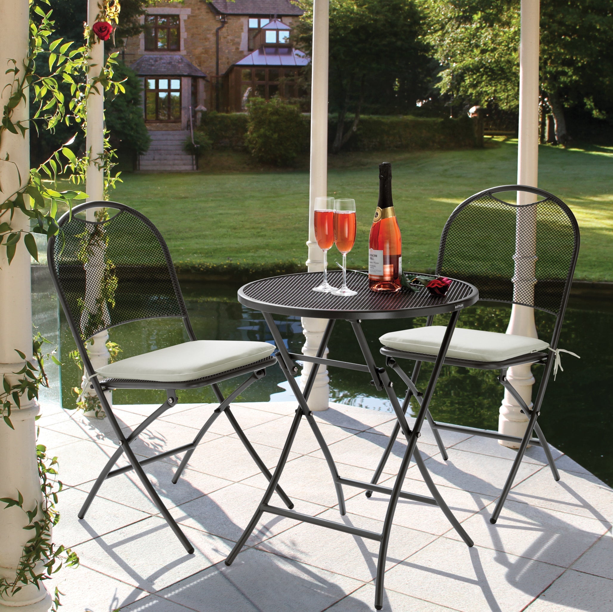 Lifestyle image of three piece cafe bistro set with two chairs and table