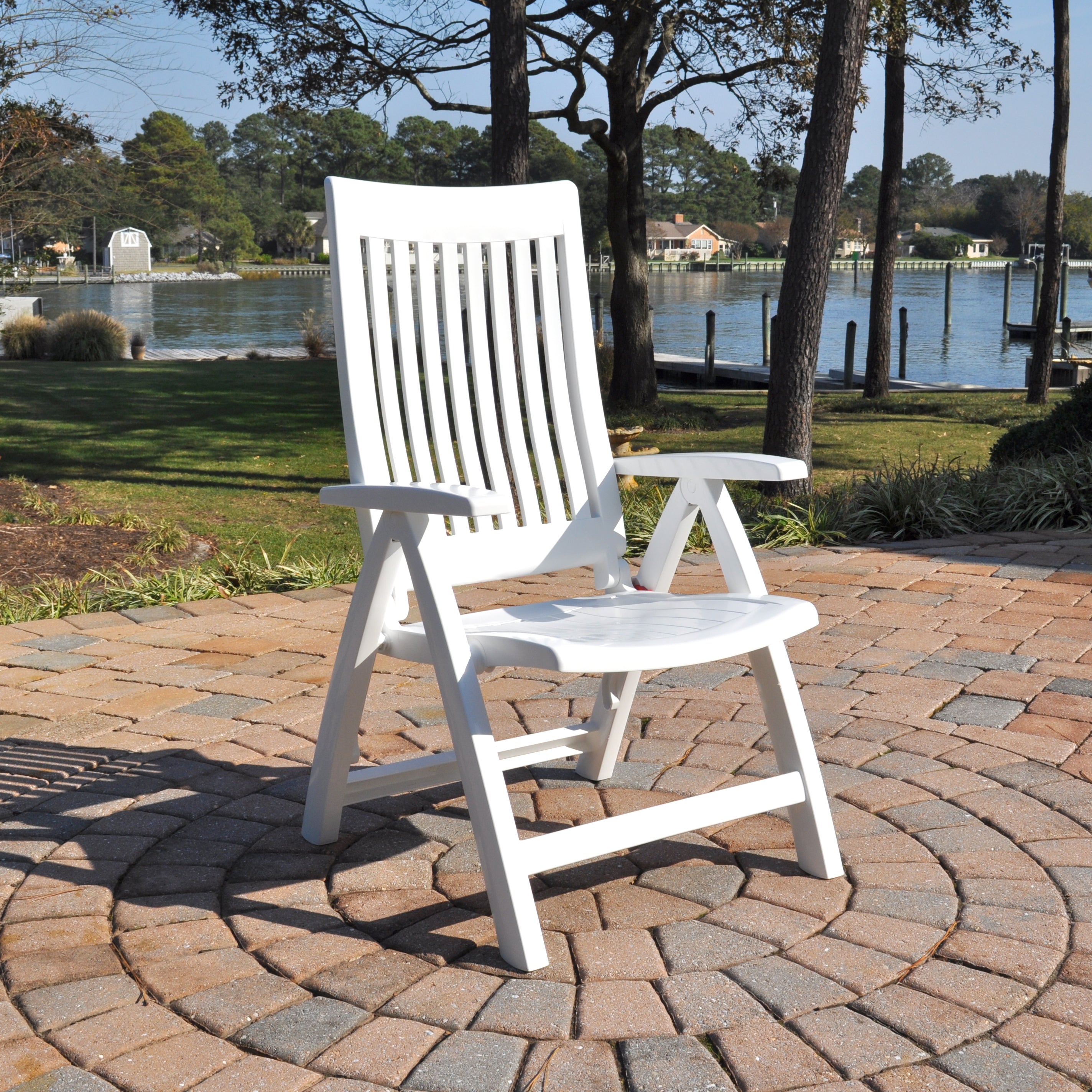 Roma 3-Piece Lounge Set with Cushions white resin multi-position chair on stone patio by lake