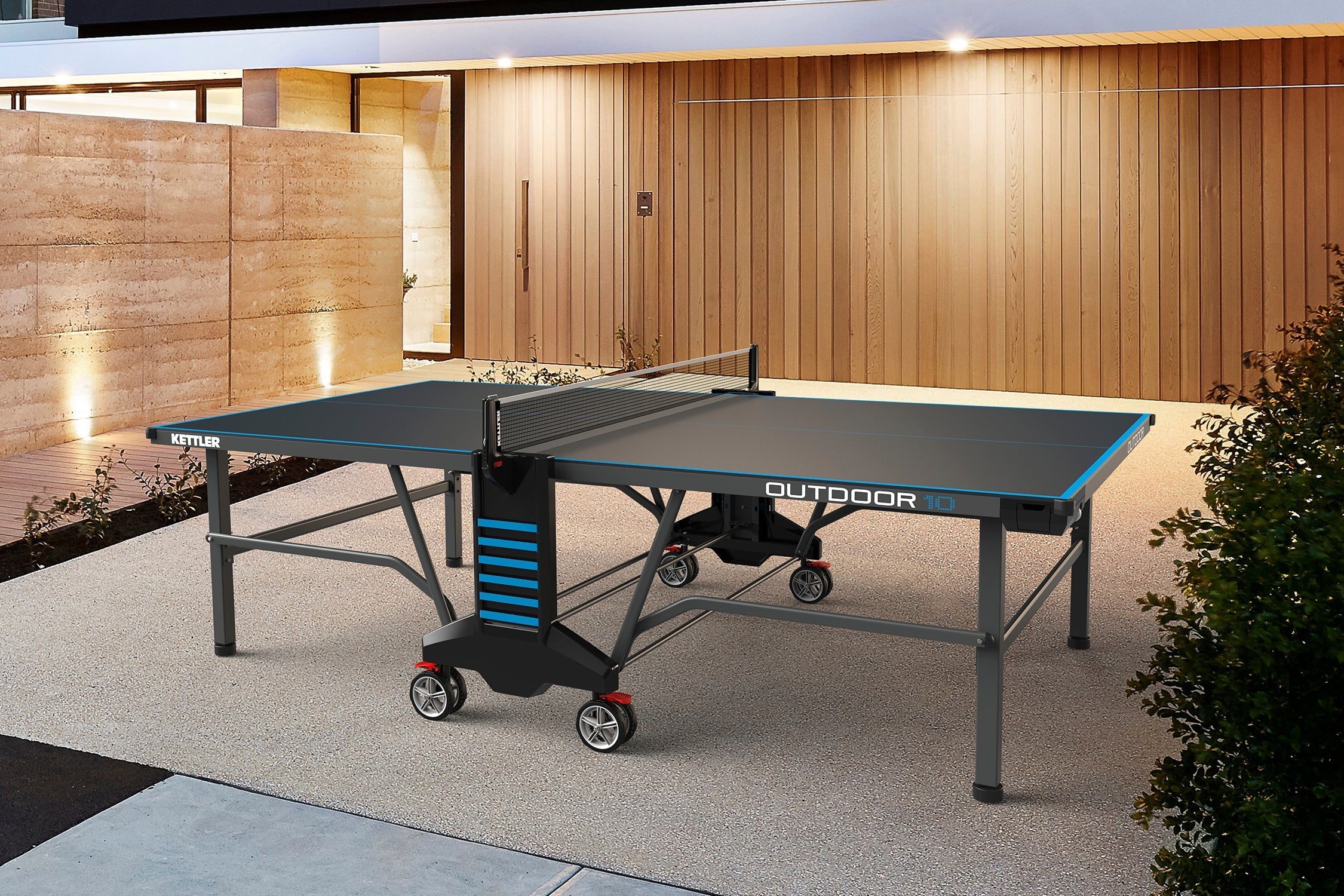 Lifestyle shot of outdoor tournament size table tennis table