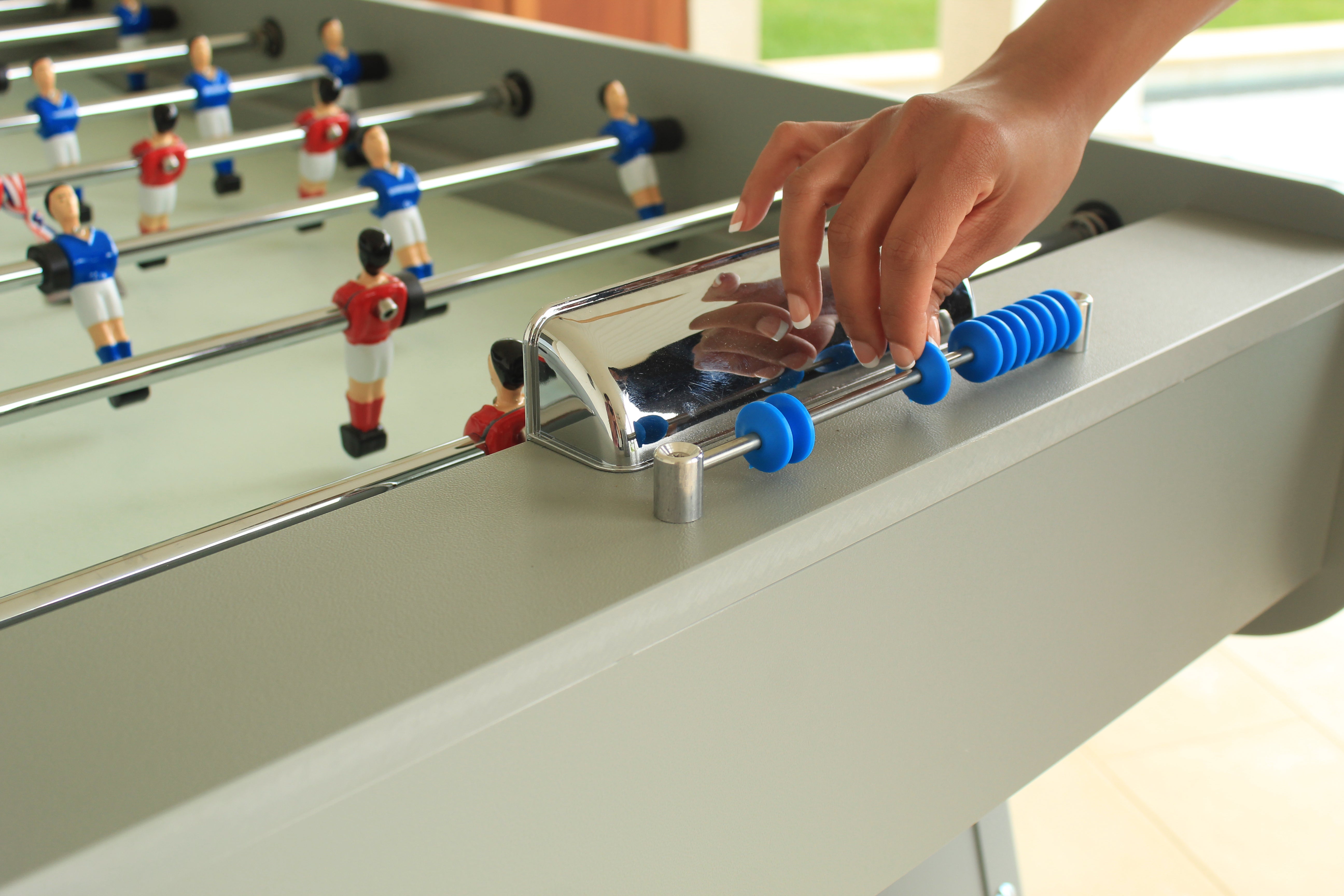 Matching resin score keeper on foosball table on patio poolside